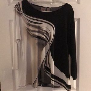 A Chicos swing top in black and cream